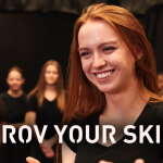 smiling lady at improv class - "improv your skills"