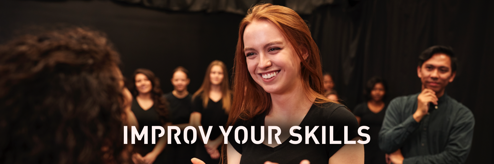 smiling lady at improv class - "improv your skills"